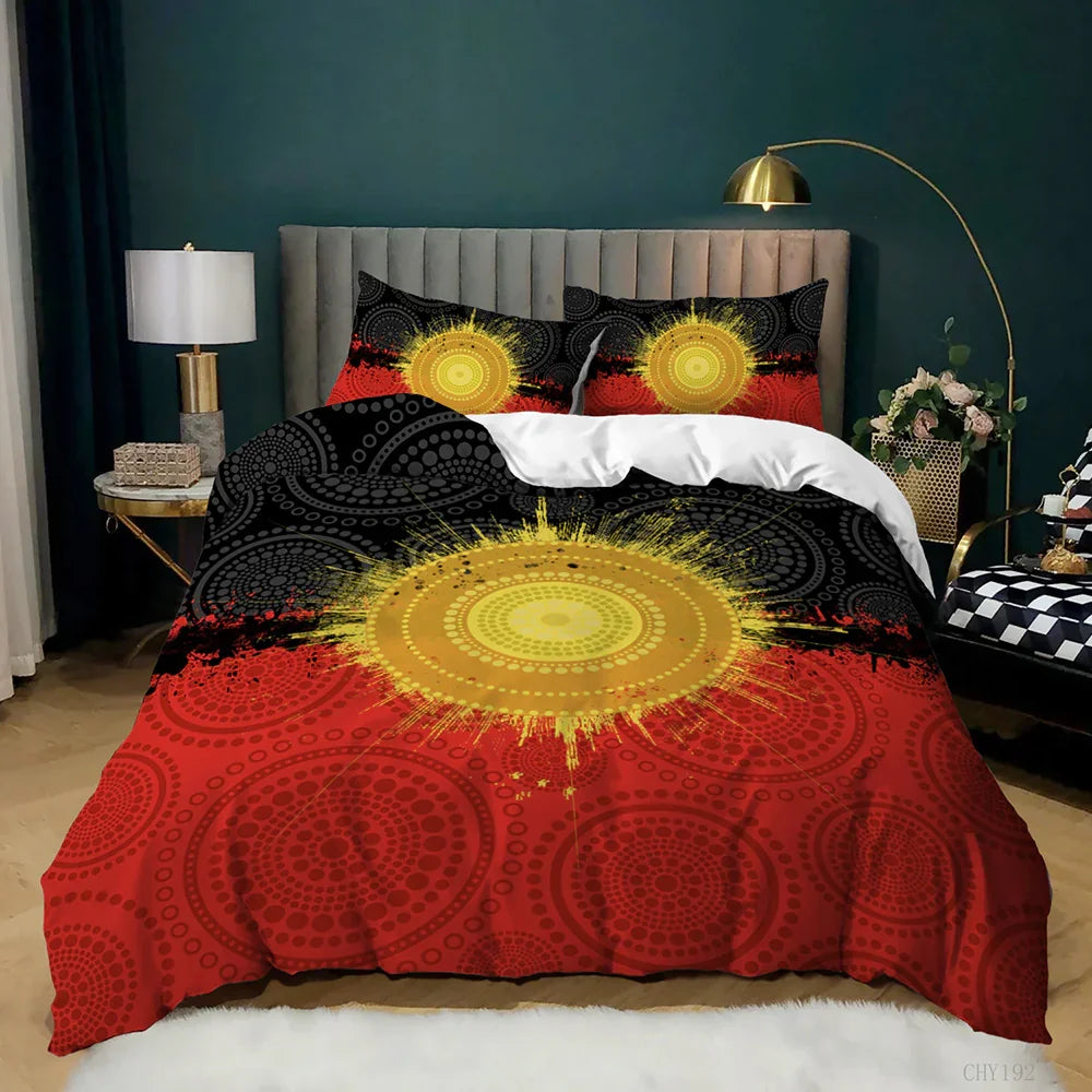 Vibrant Aboriginal art quilt cover set with sunburst design in red, black, and yellow, styled on a modern bed.