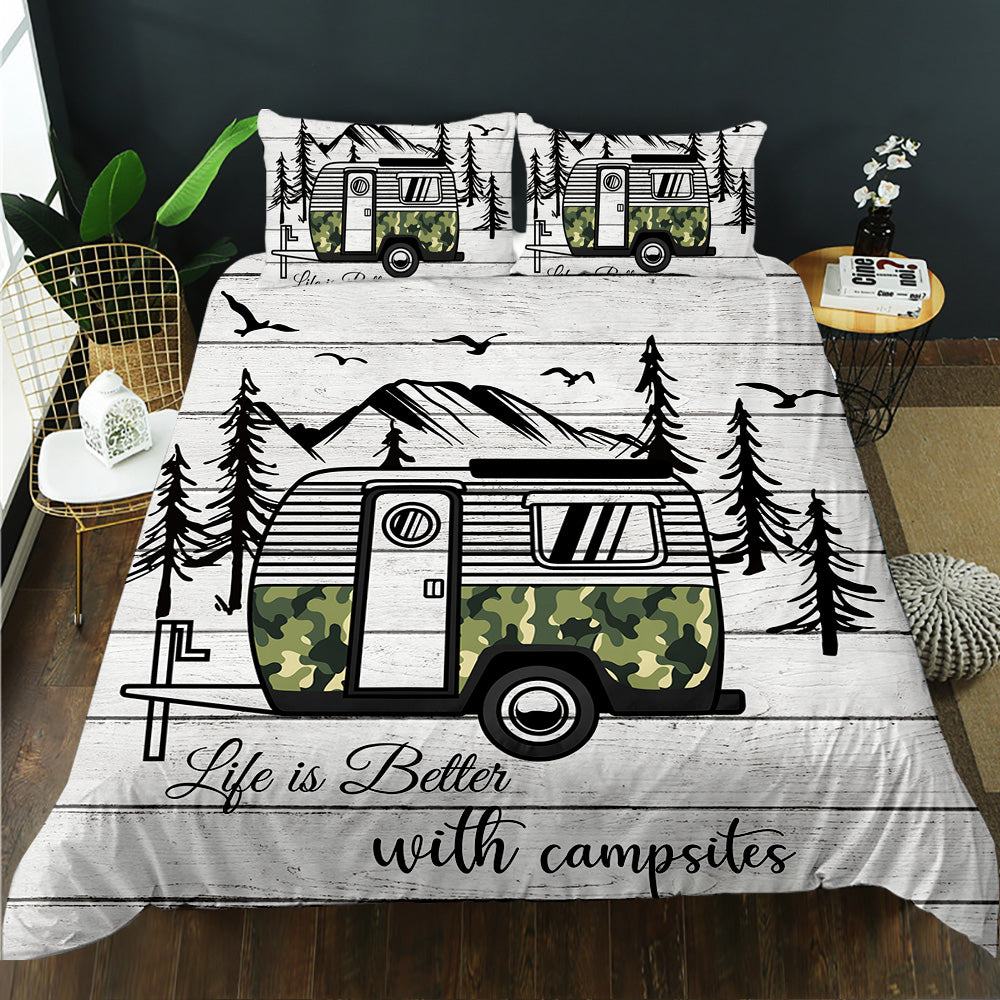 Camper-themed bedding set with trees and 'Life is Better with Campsites' text on a bed.