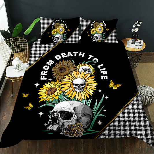 Sunflowers growing from a skull with From Death to Life text and gingham trim on a black quilt cover set