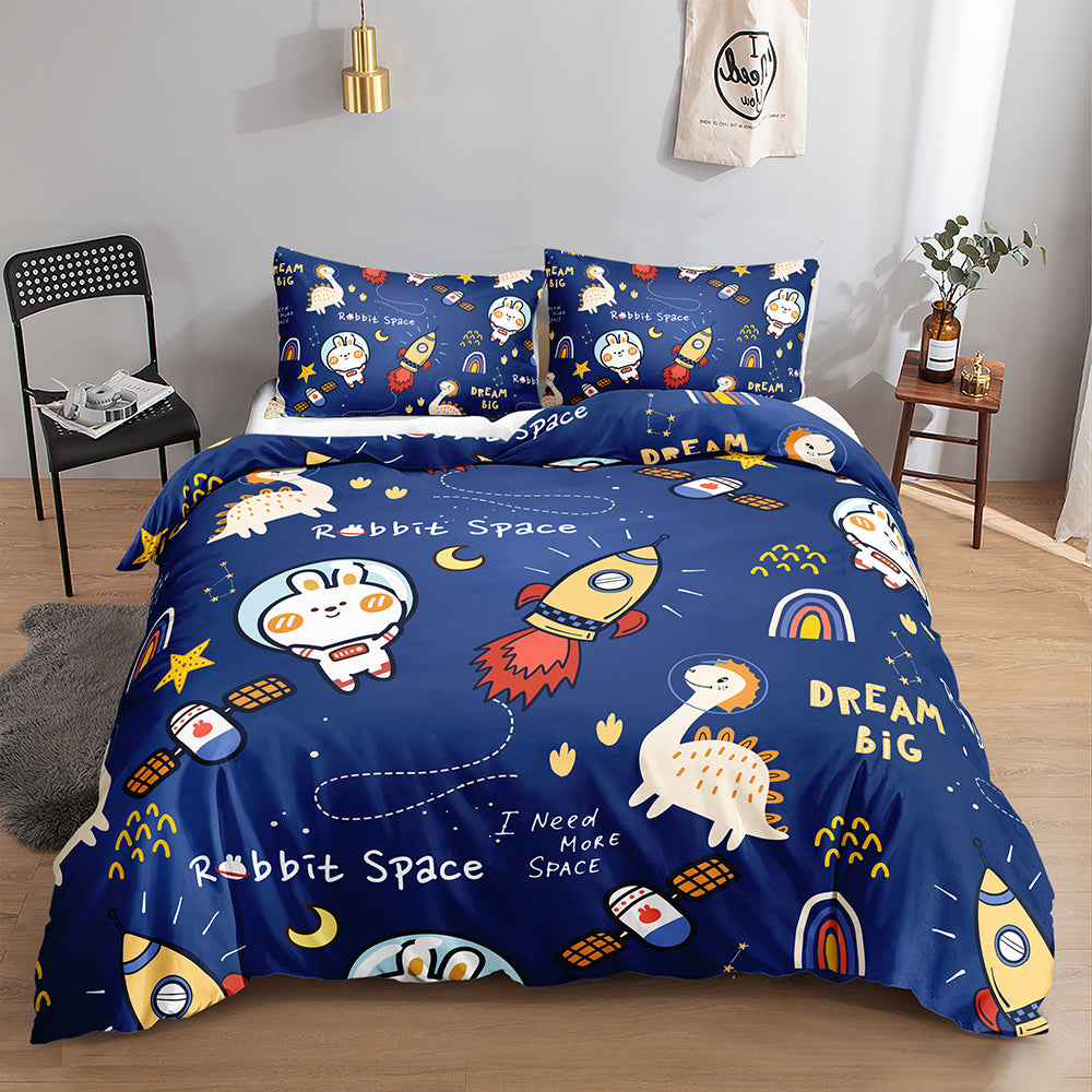 Bunny astronaut, dinosaur and rockets with Dream Big text on a navy kids quilt cover set