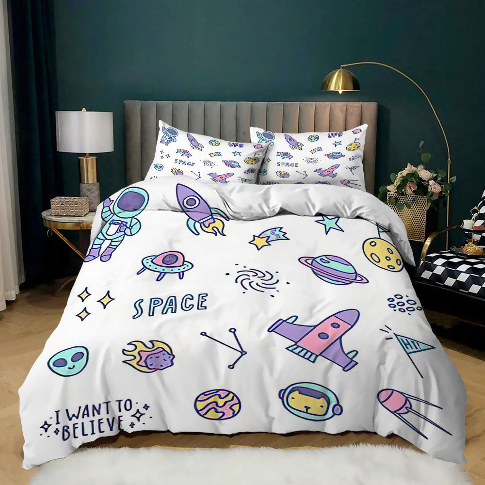 Pastel rockets, UFOs and aliens with I Want to Believe text on a white kids quilt cover set